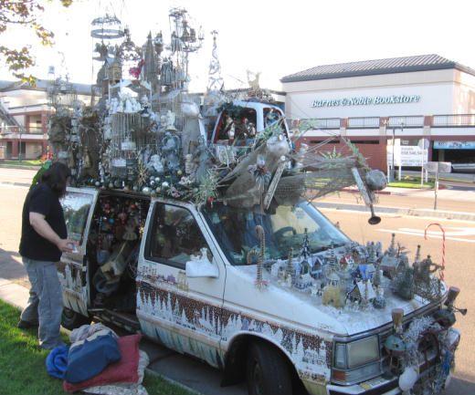 homeless man sleeps beneath angels