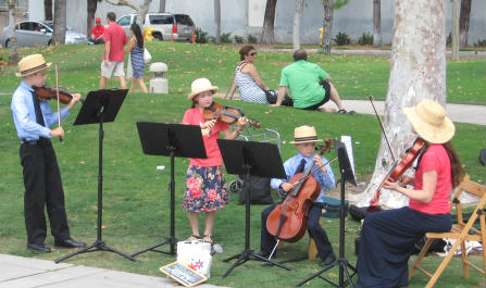 kid musician street performers by midway