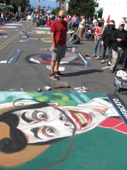 crazy colorful chalk art face in little italy