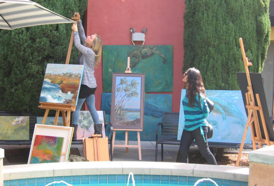 festa artist sets up some paintings