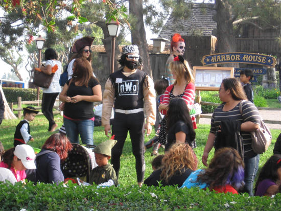 lots of adults join in halloween fun at seaport village
