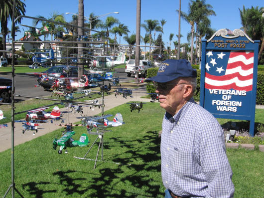 man sells aluminum can airplanes