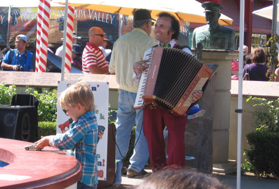musician plays accordion at italian festa