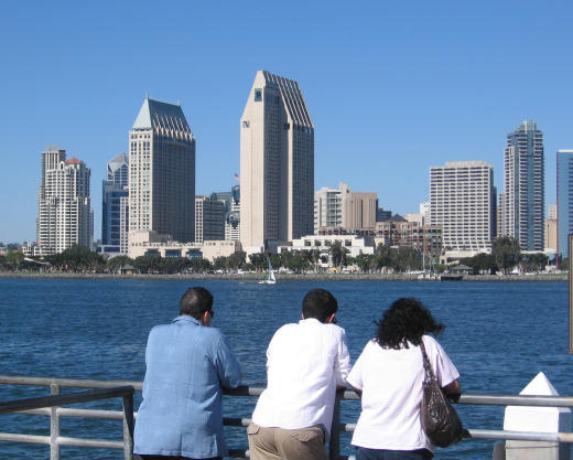 people gaze toward downtown from ferry landing