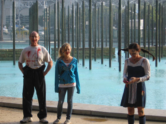 zombie family poses by fountain