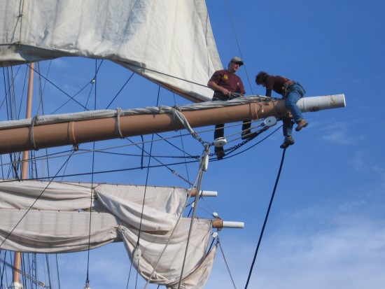 volunteers work at end of yard arm