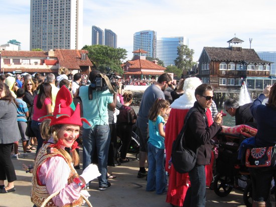 an elf anxiously awaits surfing santa's arrival