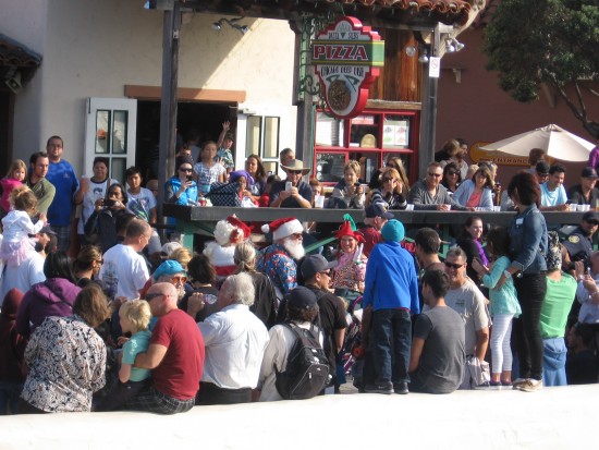santa boards pedicab sleigh at seaport village