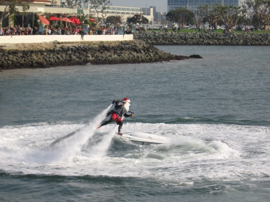 santa whirls about in a circle above the bay