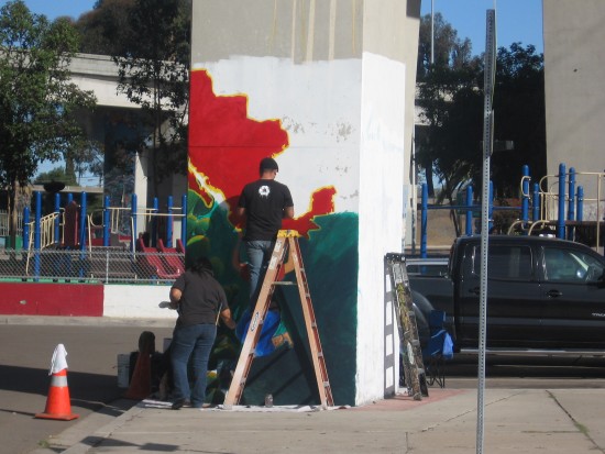 01 Artists paint image of Mexico on pillar in Chicano Park.