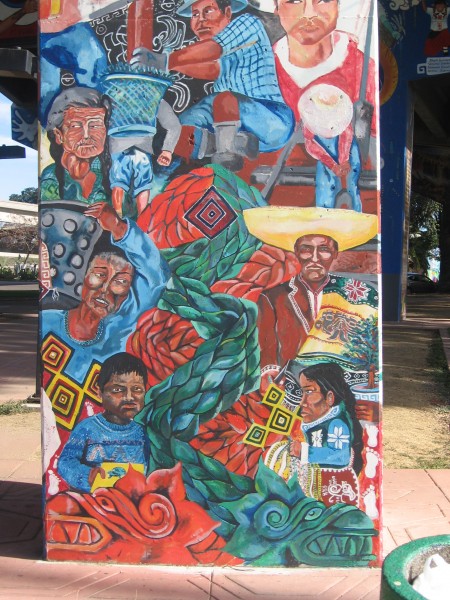 02 Colorful folk depicted in art on a freeway pillar.