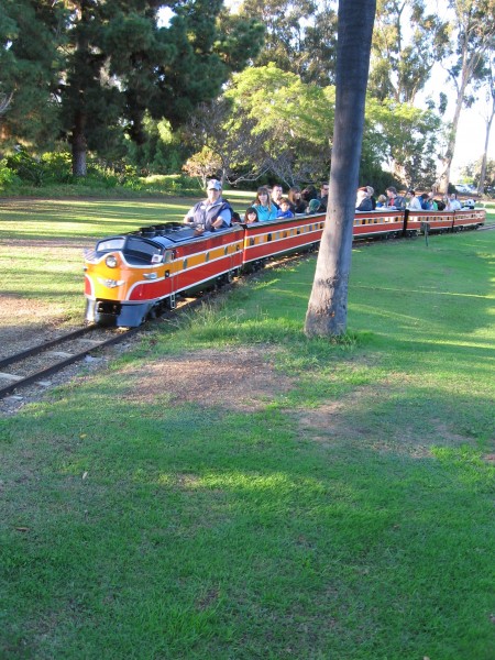 People ride the Balboa Park Miniature Railroad.