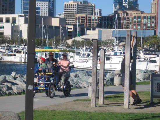 A tourist rental quadcycle heads down the park's pathway.