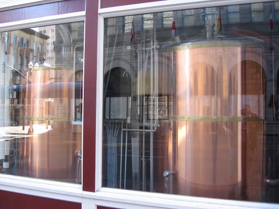 Beer fermentation tanks in a downtown San Diego window.
