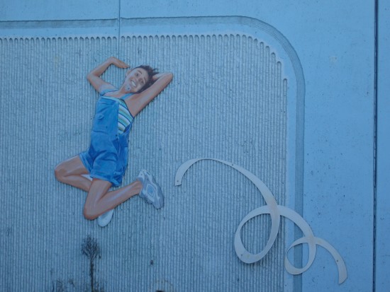 Girl jumps on beloved mural beside Interstate 8.