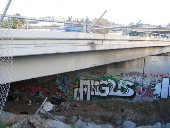 Homeless and graffiti beneath Highway 163 in Mission Valley.