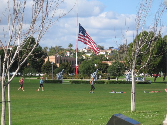 Huge Liberty Station flag at half mast.