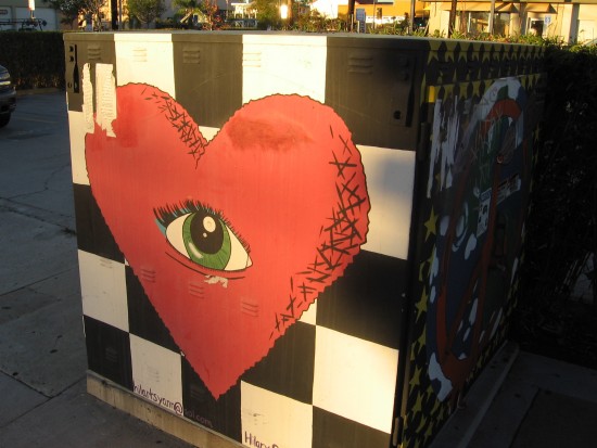 The heart's persistent eye stares out at the city.