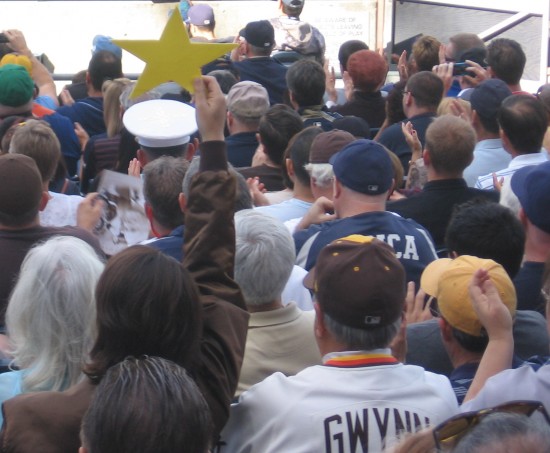 Fan holds up a star to honor Jerry Coleman.