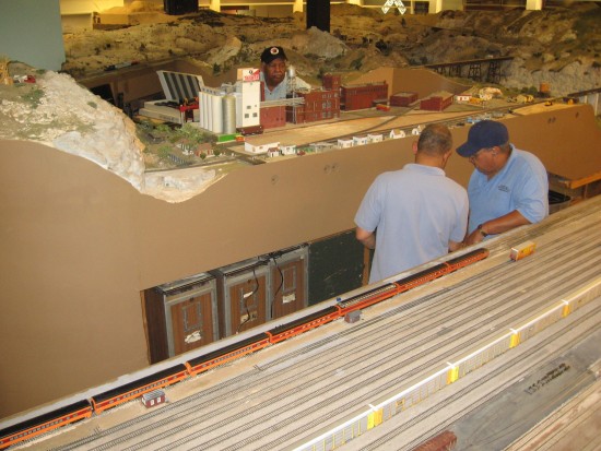 Men work on unfinished San Diego and Arizona Eastern exhibit.