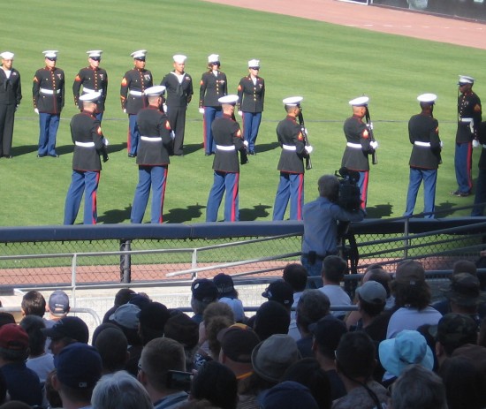 Marines fire guns to salute a true hero.