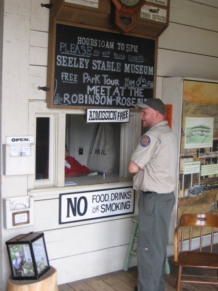 Old Town San Diego park ranger chats with ticket window lady.