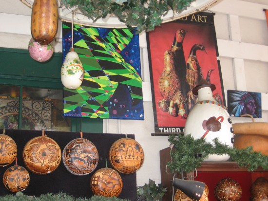 Colorfully painted gourds and posters.
