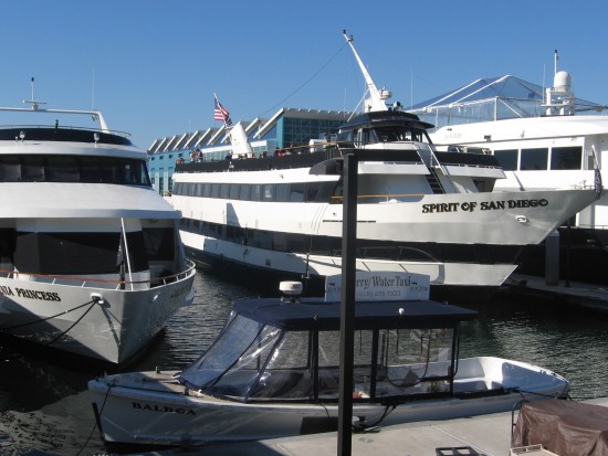 Harbor cruise ships and a Water Taxi next to Broadway Pier.