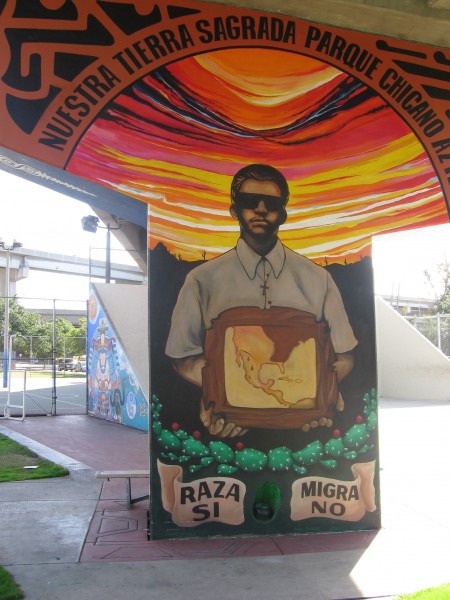 Mural supports Race, opposes the Border Patrol.