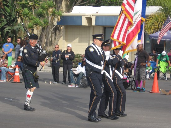 Patriotic colors precede bagpipes.
