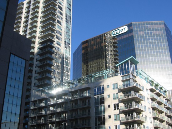 Looking up at a shining cluster of condos and office buildings.