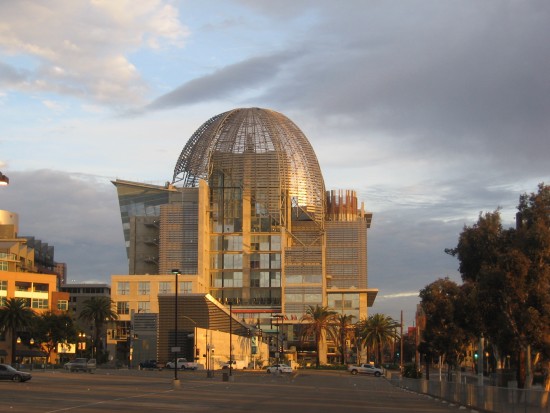 San Diego Central Library dome gilded by rising sun.