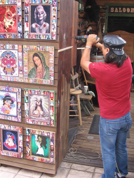 Vendor at Old Town Market at work with a power drill.