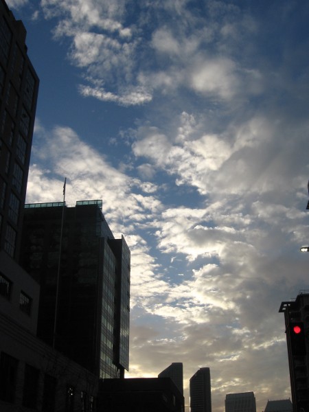 East Village buildings frame dramatic afternoon clouds.