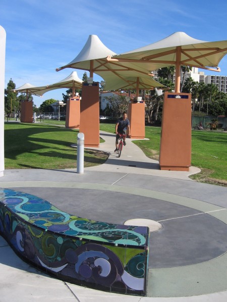Bicyclist rides through San Diego's Cancer Survivors Park.