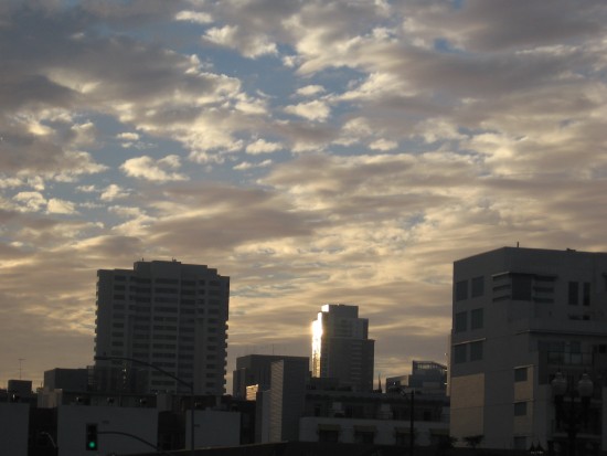 Amazing sky above a shining downtown building.