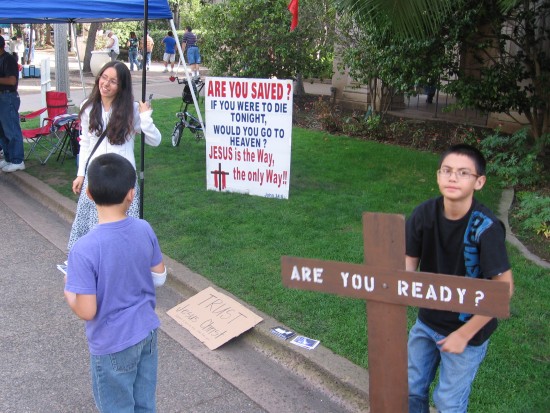 Child asks passersby if they are ready for death.