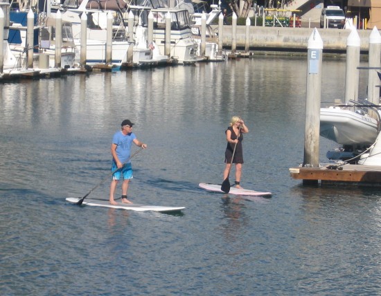Couple paddling boards in Marriott Marina.