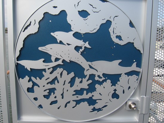 Dolphins decorate a marina gate on Harbor Island.