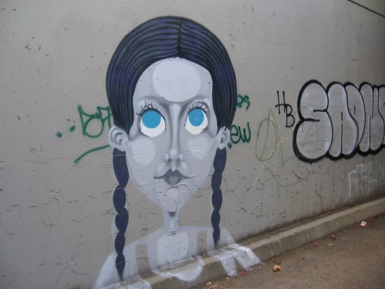 Elegant street art found on Highway 163 underpass wall.