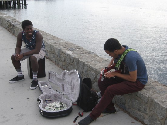 Joshua Randle and friend play music on San Diego's embarcadero.