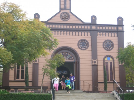 People emerge from San Diego's first synagogue, Temple Beth Israel.