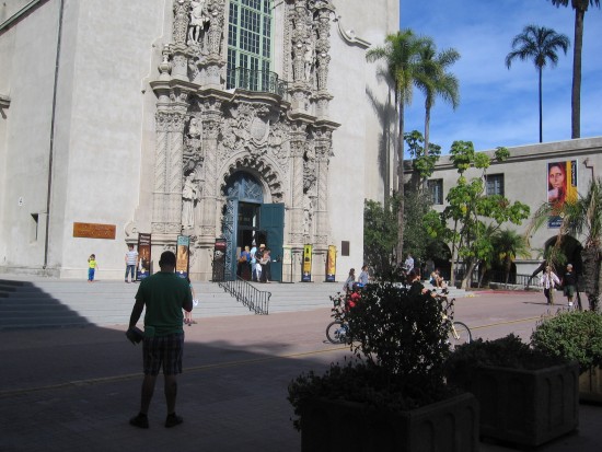 People on the street in front of the Museum of Man.