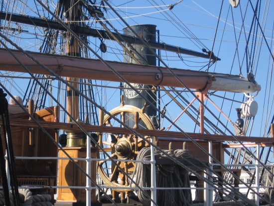 Star of India captain's wheel and tangled Maritime Museum rigging.