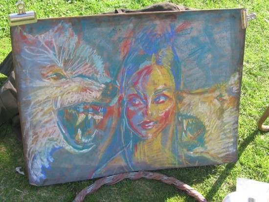 Serene face between wolves of creativity and destruction.