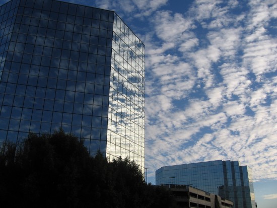 Clouds and reflections on two office buildings.