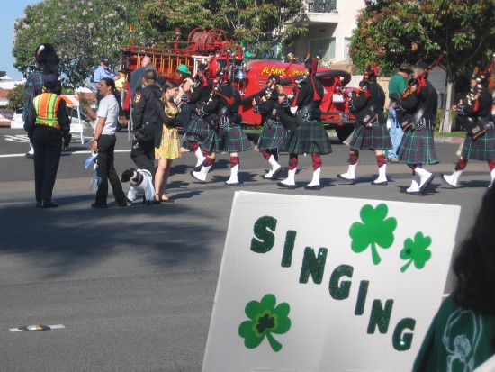 Bagpipers in kilts assemble for the parade near Balboa Park.