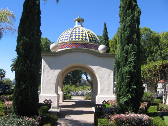 Gazebo with colored tile roof near entrance to hidden park.