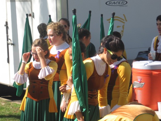 Girls anticipate marching on a sunny Saturday morning.