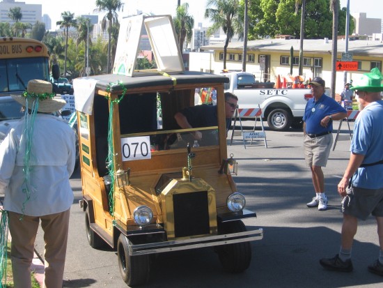 A funny little wooden vehicle in line to start the parade.